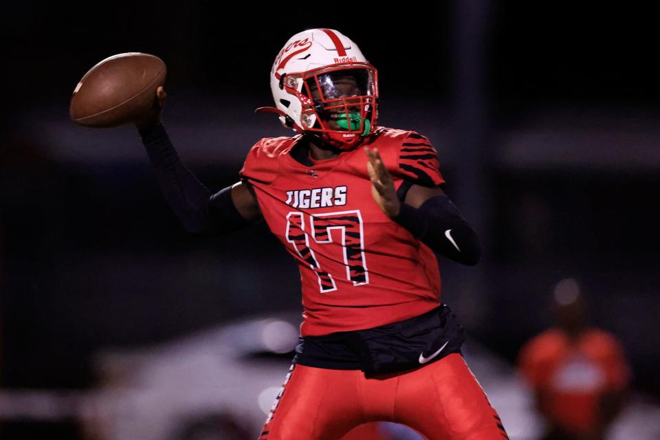 Andrew Jackson's King Johnson (17) looks to pass during the fourth quarter of a regular season football game Friday, Sept. 18, 2022 at Andrew Jackson High School football stadium in Jacksonville. The Andrew Jackson Tigers defeated the Spruce Creek Hawks 35-6. 