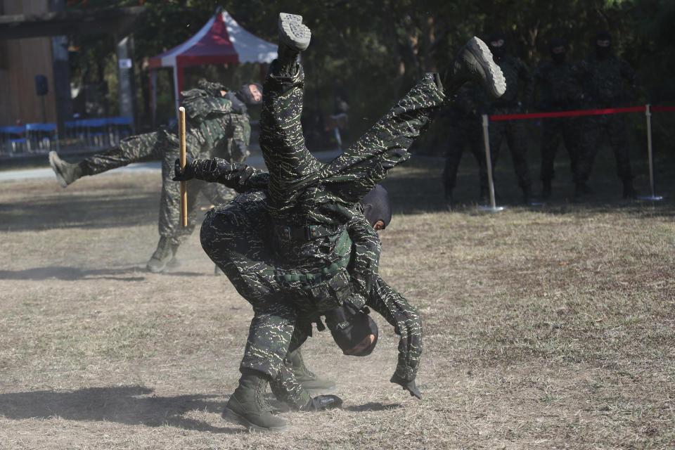 Members of Amphibious Search Team perform during a military exercise in Kaohsiung, southern Taiwan, Thursday, Jan. 16, 2020. Taiwan military is holding a two-day joint forces exercises to show its determination to defend itself from Chinese threats. (AP Photo/Chiang Ying-ying)