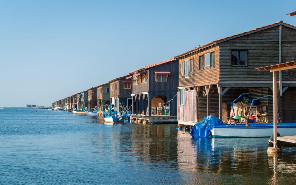 Fishing huts line the Axios Delta