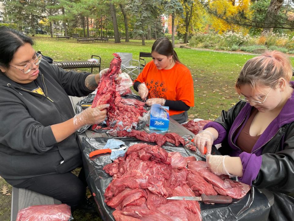 Left, Angela Ottereyes, a Cree student and part-time worker at Dawson College, organized a moose butchering activity for fellow students. 