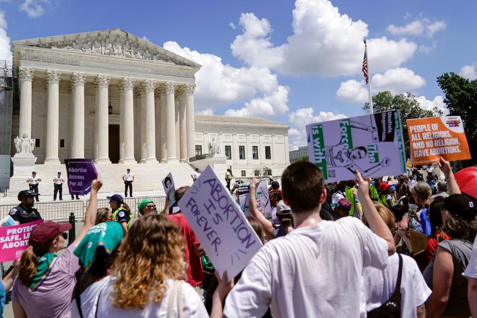 Demonstrators hold signs as they rally outside the Supreme Court building during the Women's March in Washington, Saturday, June 24, 2023. Abortion rights and anti-abortion activists held rallies Saturday in Washington and across the country to call attention to the Dobbs v. Jackson Women’s Health Organization ruling on June 24, 2022, which upended the 1973 Roe v. Wade decision.