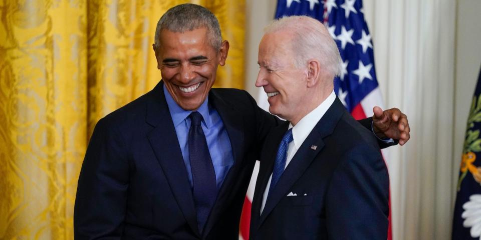 President Joe Biden and former President Barack Obama shake stand together on stage during an event about the Affordable Care Act, in the East Room of the White House in Washington, Tuesday, April 5, 2022.