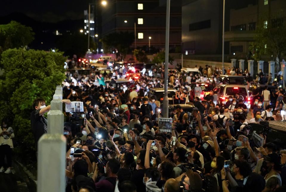 Copies of the the final edition of ‘Apple Daily’ are handed out in Hong Kong on 24 June (Reuters)