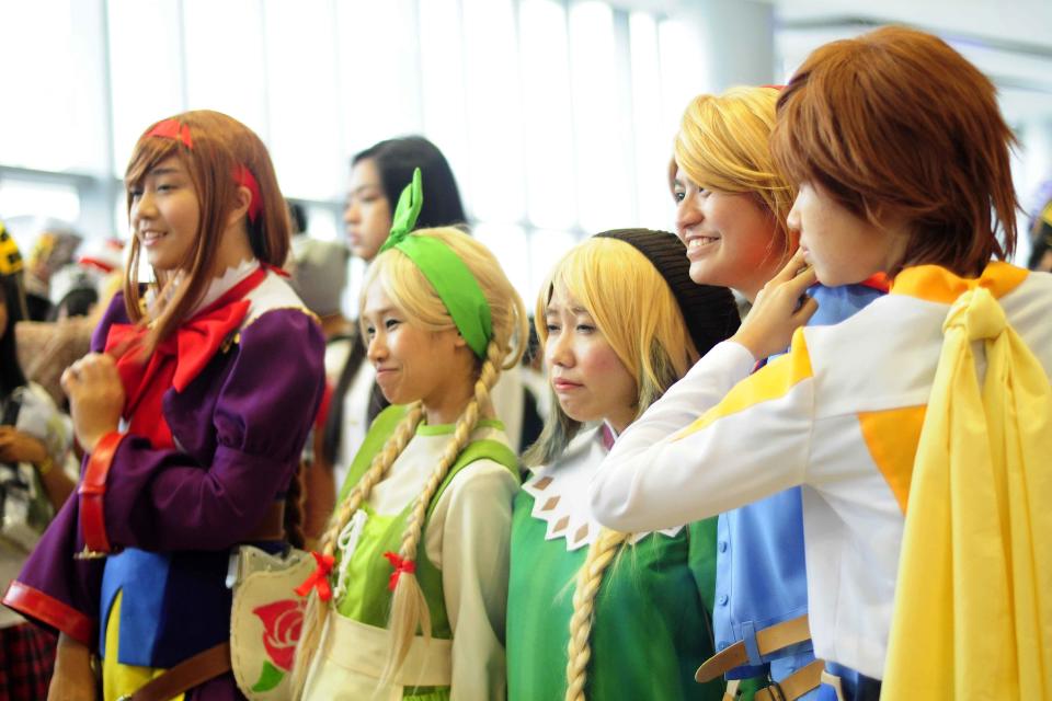 All dressed up! Cosplay enthusiasts pose for the cameras during the Cosplay Mania 2012 held at the SMX Convention Center in Pasay City on 29 September 2012. (Angela Galia/NPPA images)