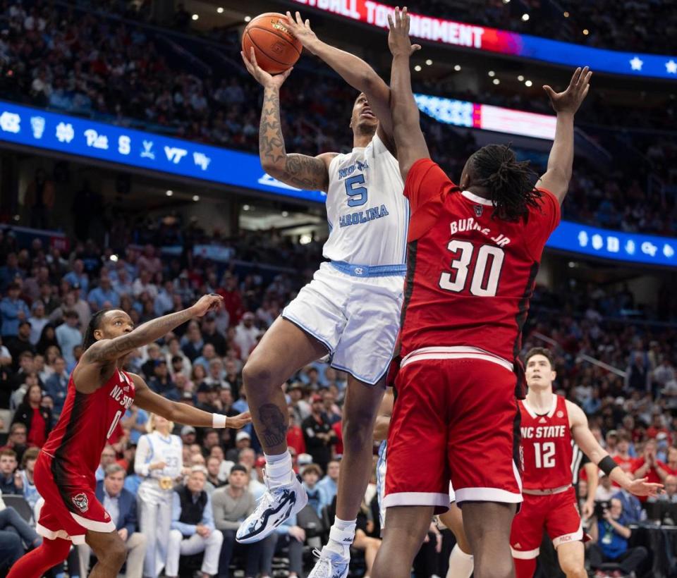 N.C. State’s D.J. Burns Jr. (30 defends North Carolina’s Armando Bacot (5) in the second half during the ACC Men’s Basketball Tournament Championship at Capitol One Arena on Saturday, March 16, 2024 in Washington, D.C. Robert Willett/rwillett@newsobserver.com