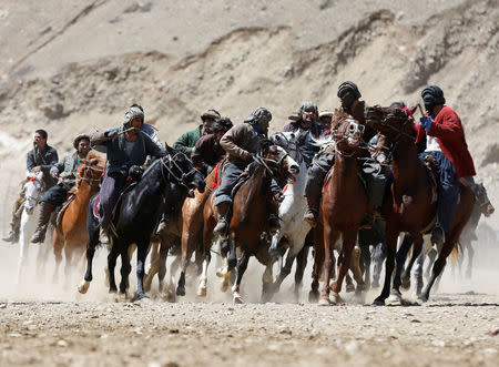 Afghan horsemen compete during a Buzkashi game in Panjshir province, north of Kabul, Afghanistan April 7, 2017. REUTERS/Omar Sobhani