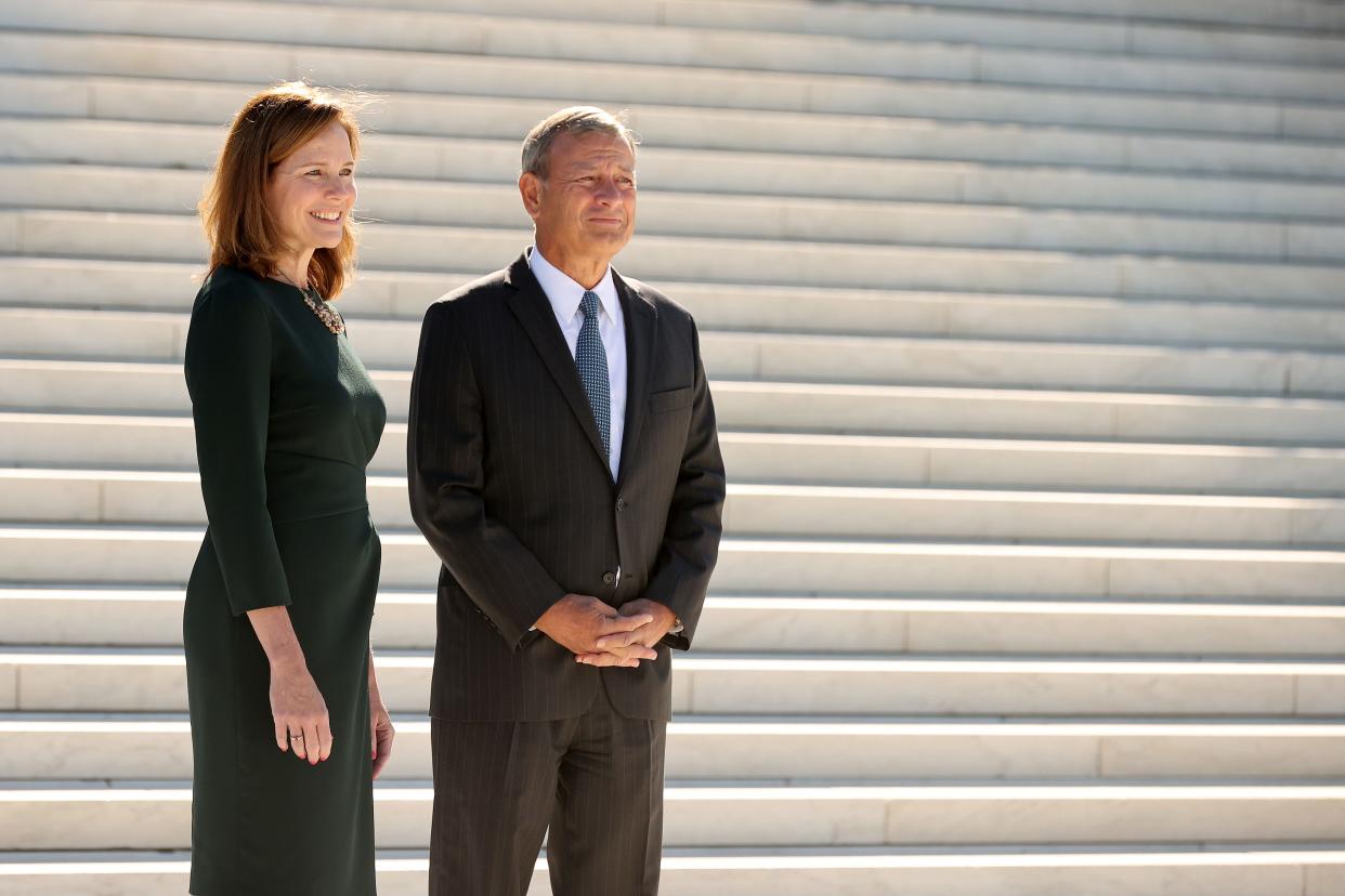 Supreme Court Associate Justice Amy Coney Barrett and Chief Justice John Roberts at the Supreme Court on October 01, 2021.