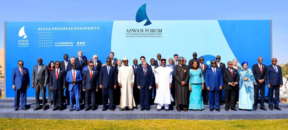 This photo provided by the office of Egypt's president Abdel-Fattah el-Sissi, dignitaries including Abdel-Fattah el-Sissi, center, gather, for a photo during a two-day forum on peace in Africa in the southern city of Aswan, Egypt, Wednesday, Dec. 11, 2019. Abdel-Fattah el-Sissi called for “decisive” and “collective” action against countries supporting “terrorism" in an apparent reference to Turkey and Qatar, who back the Muslim Brotherhood group, which is outlawed in Egypt. (Office of Egypt's president Abdel-Fattah el-Sissi via AP)