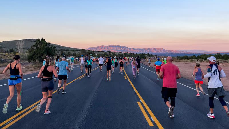 The sun rises as runners take part in the St. George Marathon on Saturday, Oct. 7, 2023.