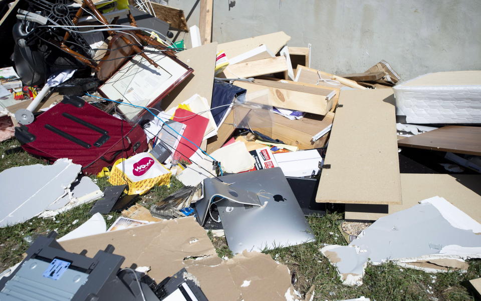 <p>Contents of an office are seen among debris from a home that was destroyed by a tornado in Dunrobin, Ont., west of Ottawa, on Saturday, Sept. 22, 2018. The storm tore roofs off of homes, overturned cars and felled power lines in the Ottawa community of Dunrobin and in Gatineau, Que. (Photo from Justin Tang/The Canadian Press) </p>