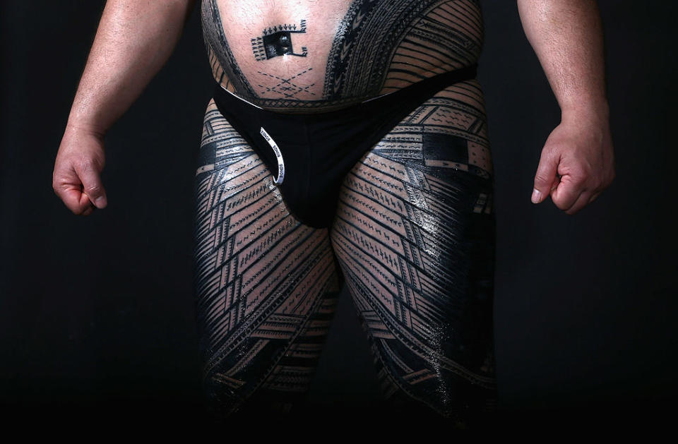Close-up of a person's midsection with patterned leggings and a black waist pouch