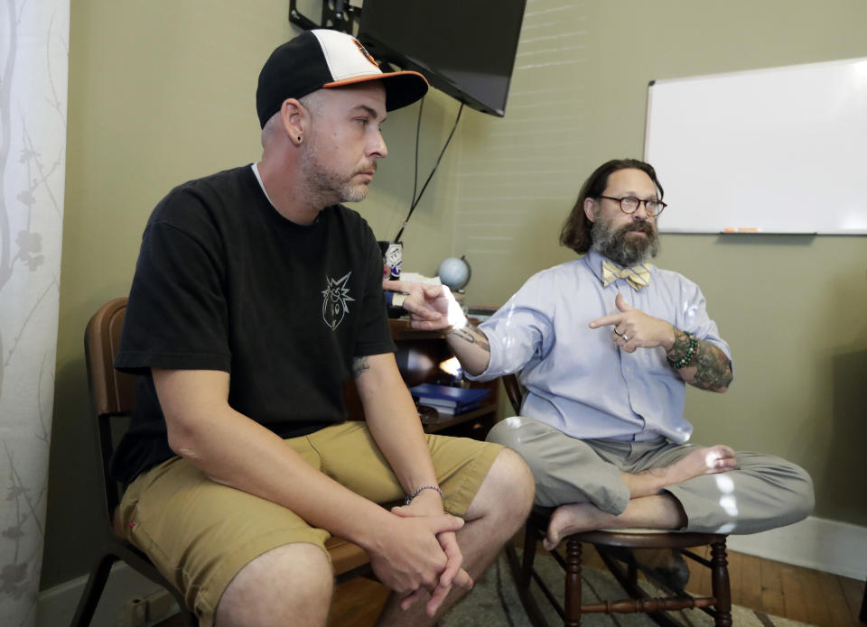 In this Oct. 8, 2018, photo, Tim Nolen, left, participates in a relapse prevention group session with counselor Bob Benson, right, at a treatment facility run by Buffalo Valley Inc. in Nashville, Tenn. Nolen has no health insurance coverage and his treatment for opioid addiction is funded by a grant program Congress approved in 2016 under the 21st Century Cures Act. (AP Photo/Mark Humphrey)