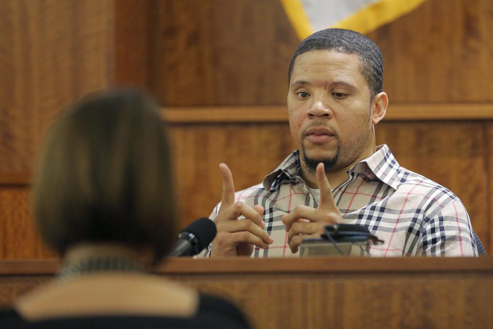 Prosecution witness Alexander Bradley describes a gun he saw with former New England Patriots football player Aaron Hernandez on a trip to Florida, during Hernandez's murder trial at Bristol County Superior Court in Fall River, Massachusetts April 1, 2015. Bradley, a former friend of Hernandez, testified on Wednesday that he saw the ex-New England Patriots player handle a gun similar to the one prosecutors contend he used to murder an acquaintance, and that Hernandez had a distrustful nature. Hernandez, 25, is charged with killing Odin Lloyd, who was dating his fiancee's sister. REUTERS/Brian Snyder