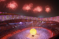 FILE - Fireworks explode over the National Stadium during the opening ceremony for the Beijing 2008 Olympics in Beijing on Aug. 8, 2008. Ai is one of China's most famous artists, and many regard him as one of the world's greatest living artists. Working with the Swiss architectural firm Herzog & de Meuron, he helped design the Bird's Nest stadium, the centerpiece of Beijing's 2008 Summer Olympics. The stadium will also host the opening ceremony for Beijing's Winter Olympics on Feb. 4, 2022. (AP Photo/Julie Jacobson, File)