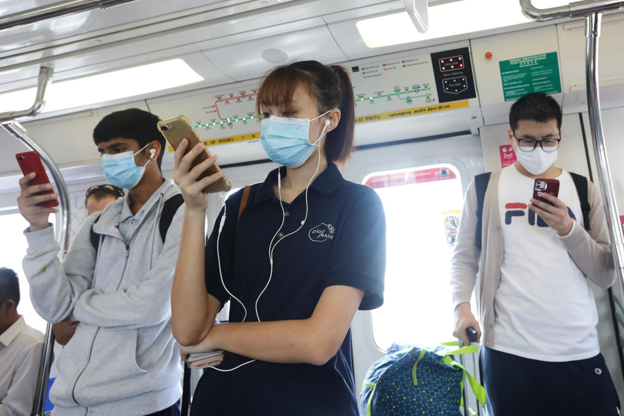 SINGAPORE - JANUARY 30:  Passengers are seen wearing a protective mask on a train ride on January 30, 2020 in Singapore. Singapore has confirmed ten cases of the deadly coronavirus, which emerged last month in the city of Wuhan in China. The virus has since spread to 21 countries with 170 deaths reported as of January 30.  (Photo by Suhaimi Abdullah/Getty Images)