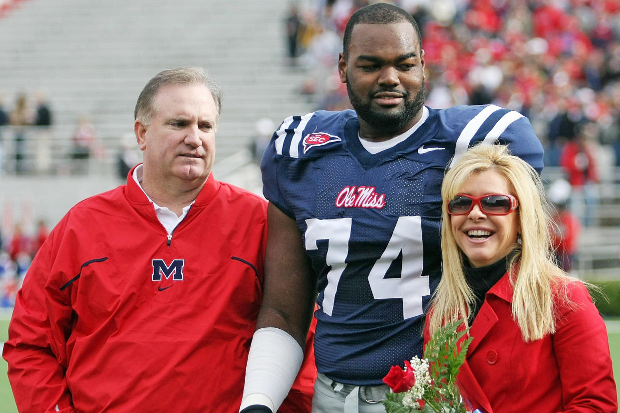 Michael Oher with Sean and Leigh Anne Tuohy prior to an Ole Miss game in 2008. (Matthew Sharpe / Getty Images file)