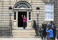 Scotland's First Minister and Scottish National Party leader Nicola Sturgeon poses for photographers, at Bute House in Edinburgh, Scotland. Sunday, May 9, 2021. British Prime Minister Boris Johnson has invited the leaders of the U.K.’s devolved nations for crisis talks on the union after Scotland’s pro-independence party won its fourth straight parliamentary election. Sturgeon said the election results proved a second independence vote for Scotland was “the will of the country." She said any London politician who stood in the way would be “picking a fight with the democratic wishes of the Scottish people.” (AP Photo/Scott Heppell)