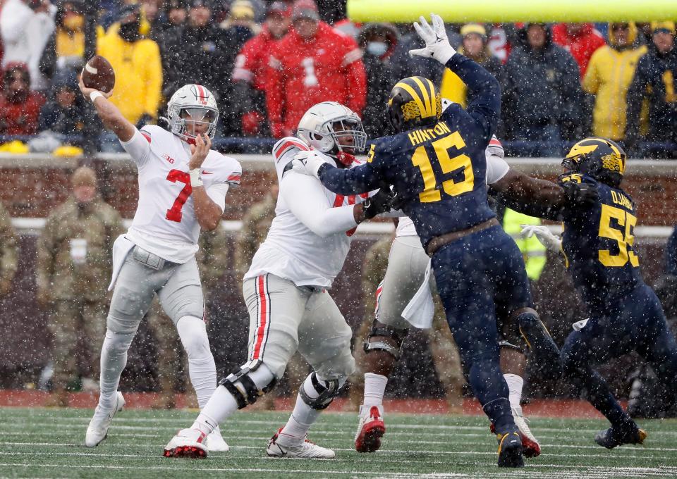 Ohio State Buckeyes quarterback C.J. Stroud (7) throws the ball against Michigan Wolverines defense during the first quarter of their NCAA College football at Michigan Stadium at Ann Arbor, Mi on November  27, 2021. 