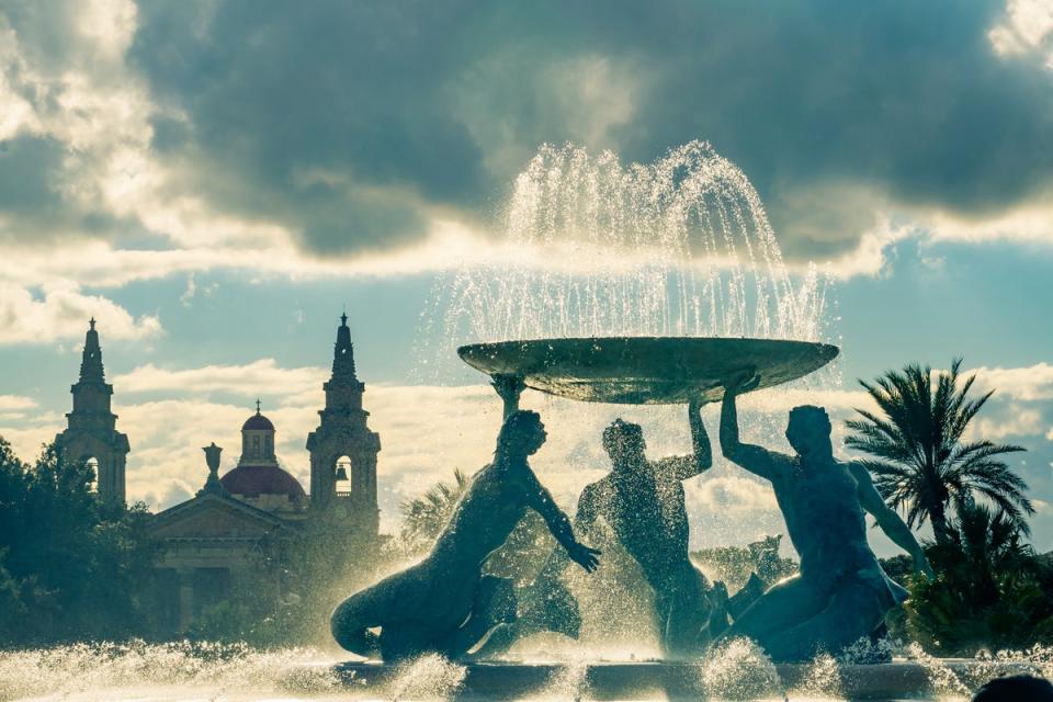 At the entrance of Valletta’s gates, the fountain’s three bronze Tritons balance a basin of water (Getty Images)