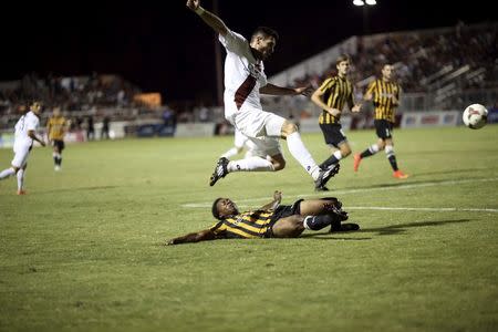 Host team Sacramento Republic FC (in white) and Charleston Battery compete in a soccer match at Bonney Field, the team's home ground, in Sacramento, California August 27, 2014. REUTERS/Robert Galbraith