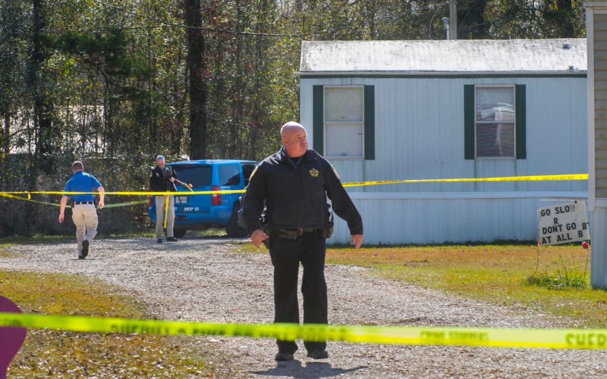 Investigators at the scene of the shooting in Livingston Paris, Louisiana - The Advocate