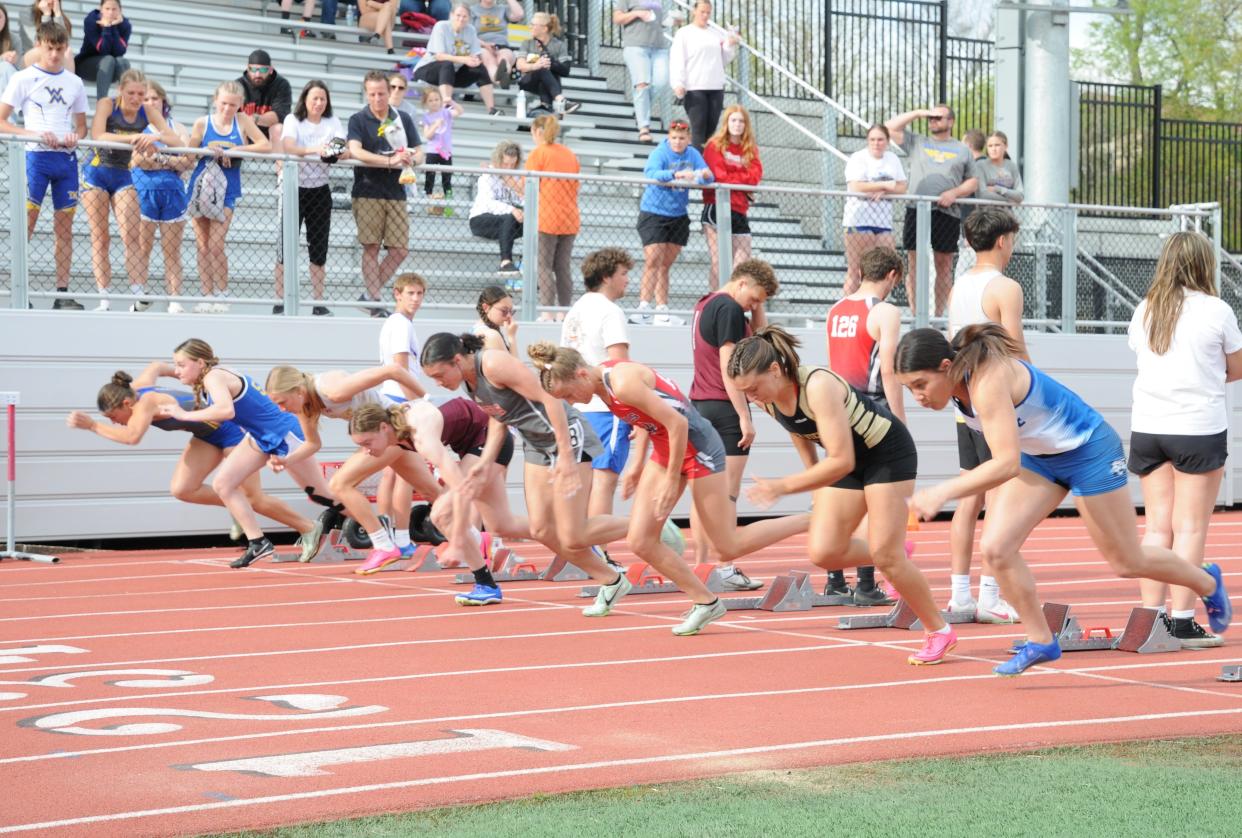 Runners from West Muskingum, Cambridge, John Glenn, Sheridan, Tri Valley, River View and St. Clairsville take off in the 100 meter dash.