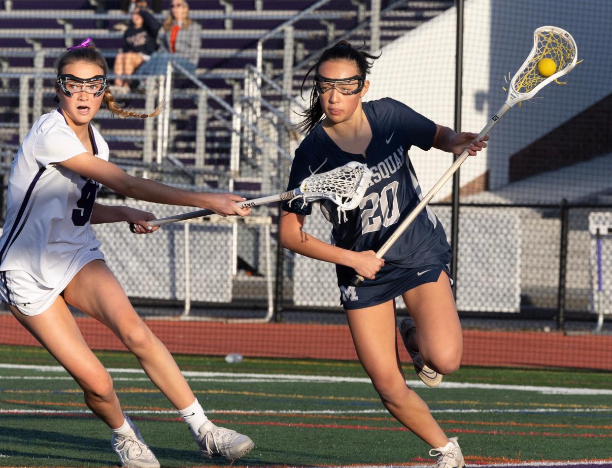 Rumson Chase Memmott tries to stop Manasquan’s Talia Blum as she rushes the goal. Manasquan Girls Lacrosse outlasts Rumson-Fair Haven 10-9 in Rumson on April 23, 2024.