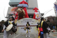 Dancers in traditional costumes perform to celebrate the opening of this year's trading in Seoul, South Korea, Thursday, Jan. 2, 2020. Asian shares were mostly higher on optimism about a U.S.-China trade deal as most of the region's markets opened the new year's first day of trading Thursday. (AP Photo/Ahn Young-joon)