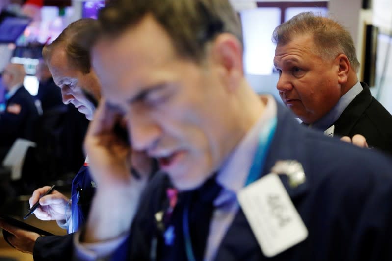 Traders work on the floor of the New York Stock Exchange shortly after the opening bell in New York City