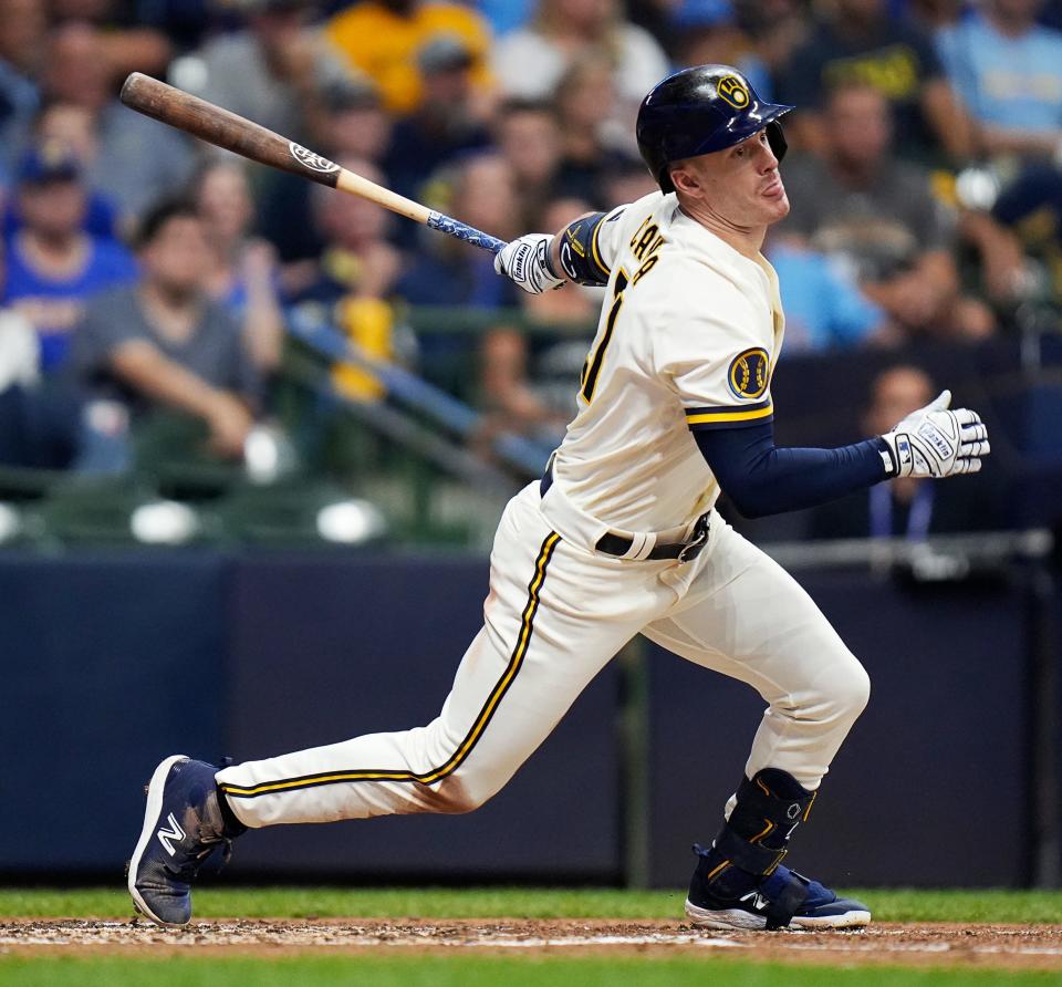 Milwaukee Brewers designated hitter Mark Canha (21) a singles on a ground ball to Arizona Diamondbacks right fielder Corbin Carroll (7) during the third inning of Game 2 of the NL wild-card playoff series on Wednesday October 4, 2023 at American Family Field in Milwaukee, Wis.