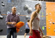 Drew Ruana (R), 16, a competitive climbing national champion, trains as his father Rudy Ruana watches at Stone Gardens rock climbing gym in Bellevue, Washington October 20, 2015. REUTERS/Jason Redmond