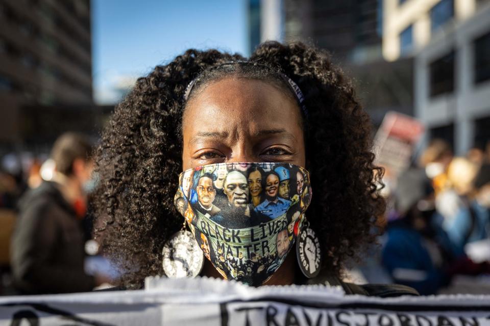 Demonstrators protest outside the Hennepin County Government Center before jury selection begins at the trial of former Minneapolis Police officer Derek Chauvin on March 8 in Minneapolis.