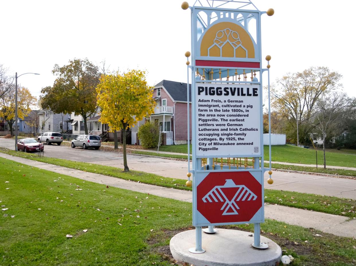 A sign explains the history of the Piggsville neighborhood on West St. Paul Avenue and North 37th Street in Milwaukee.