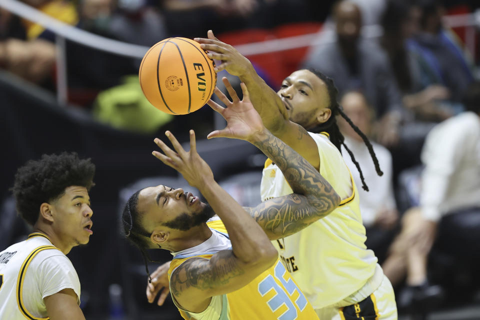 Southern University guard Tyrone Lyons (35) and Grambling State guard Jourdan Smith, right, battle for a rebound in the first half of an NBA All-Star HBCU classic college basketball game Saturday, Feb. 18, 2023, in Salt Lake City. (AP Photo/Rob Gray)