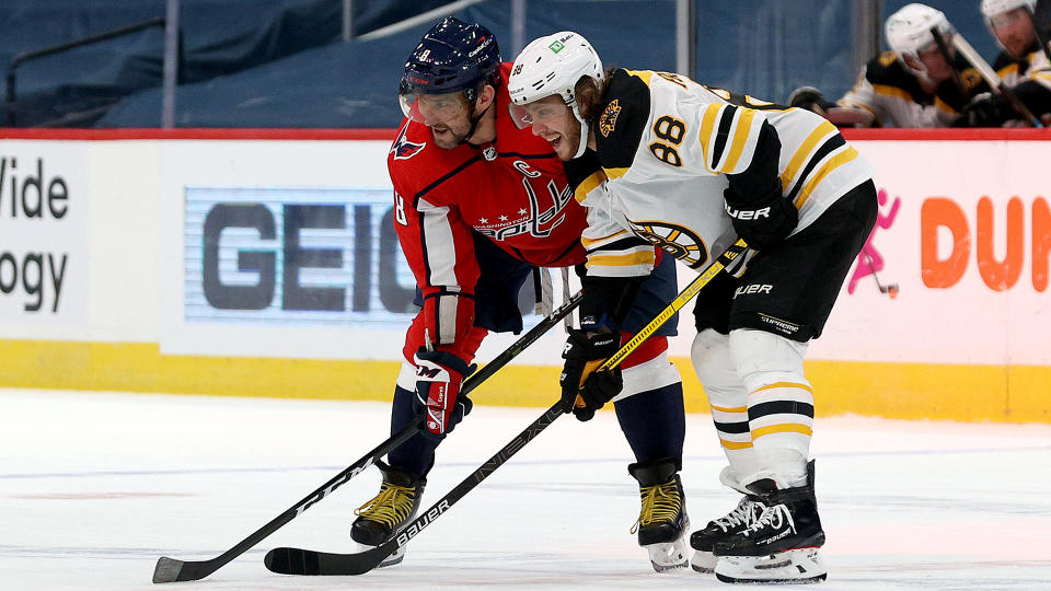 Alex Ovechkin (left) and David Pastrnak are two must-watch NHL players this season for two very different reasons. (Photo by Rob Carr/Getty Images)