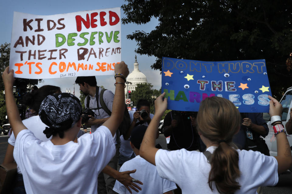 Families march past the U.S. Capitol as they protest the separation of immigrant families, Thursday, July 26, 2018, on Capitol Hill in Washington. The Trump administration faces a court-imposed deadline Thursday to reunite thousands of children and parents who were forcibly separated at the U.S.-Mexico border, an enormous logistical task brought on by its "zero tolerance" policy on illegal entry. (AP Photo/Jacquelyn Martin)