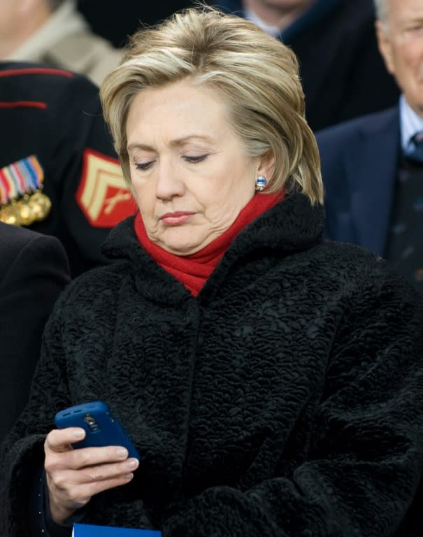 Hillary Clinton checks her Blackberry during the Veterans Day rededication of the Intrepid Sea, Air & Space Museum in New York, in 2008