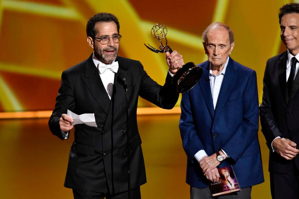 Tony Shalhoub, left, with Bob Newhart and Ben Stiller watching, accepts the award for supporting actor in a comedy series for his role on "The Marvelous Mrs. Maisel" at the 71st Primetime Emmy Awards Sunday night. The award was the fourth Emmy for Shalhoub, a Green Bay native.