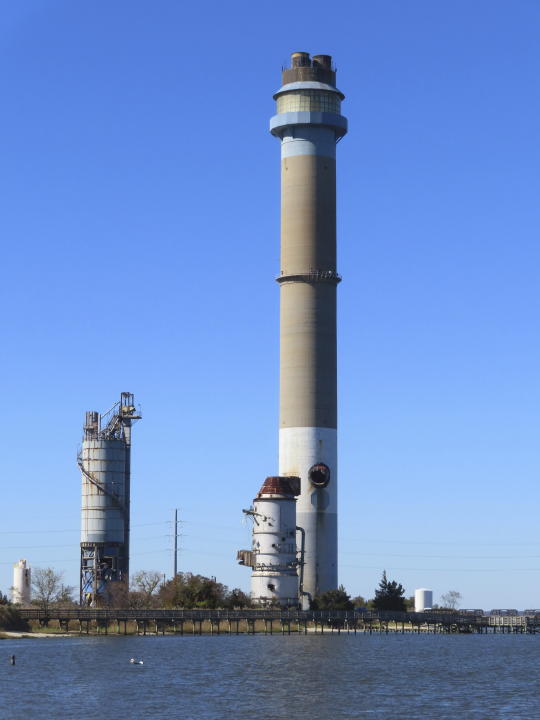 The smokestack of the former B.L. England power plant in Upper Township, N.J., stands on Oct. 23, 2023 photo. The 463-foot stack will be imploded on Wednesday, Oct. 26, 2023. (AP Photo/Wayne Parry)