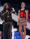 Ezra Miller, left, and Emma Watson speak onstage at the MTV Video Music Awards on Thursday, Sept. 6, 2012, in Los Angeles. (Photo by Matt Sayles/Invision/AP)