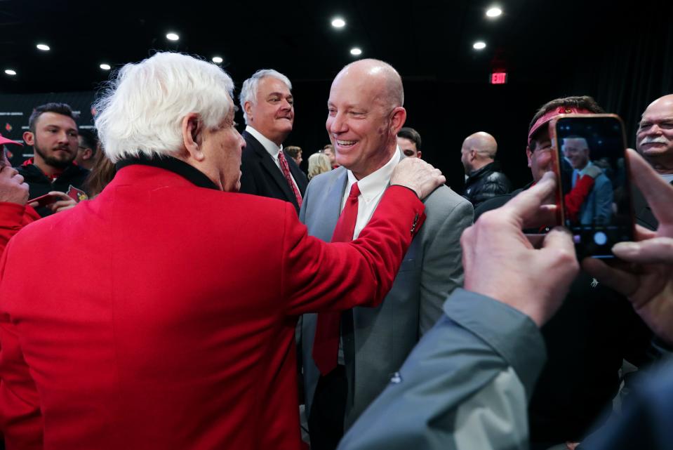 New U of L head football coach Jeff Brohm, center, greeted supporters following the announcement of his new position at Cardinal Stadium in Louisville, Ky. on Dec. 8, 2022.