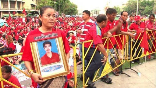 Tens of thousands of anti-government "Red Shirts" gathered in Bangkok on Sunday to mark a year since deadly clashes between troops and protesters during their mass rally in the capital. 