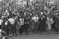 <p>Dr. Martin Luther King, third from right, marchers across the Alabama River on the first of a five day, 50 mile march to the state capitol at Montgomery, Ala., on March 21, 1965. (AP Photo) </p>