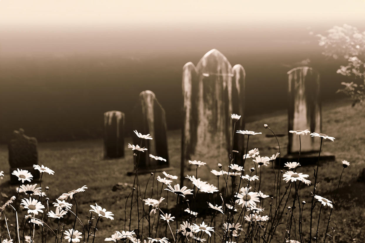 cemetery gravestones flowers Getty Images/La_Corivo