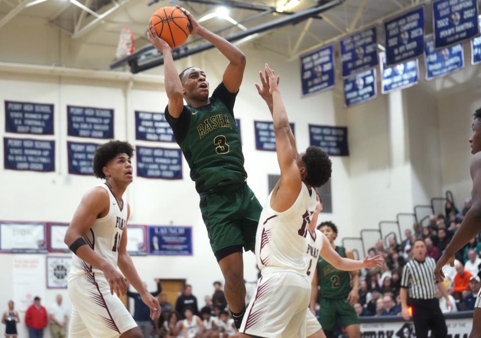 Basha Bears guard Mason Magee (3) shoots the ball over Perry Pumas guard No No Brown (11) at Perry High School in Gilbert on Jan. 6, 2024.