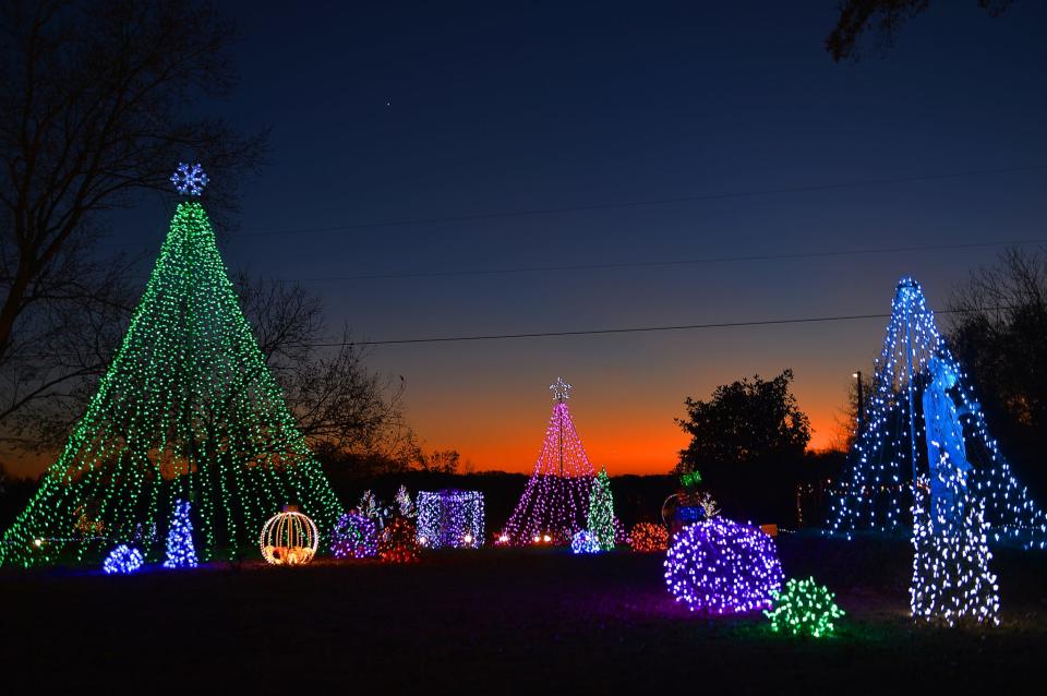 The Christmas House is lit up for the holidays in Inman, Thursday evening, December 2, 2021. Owners Bill and Sandra Montgomery continue the tradition of a brilliant Christmas lights display at the home, starting on Thanksgiving Day and going through New Year's Eve. The 1.5-acre display is located at 360 Foster Road in Inman.