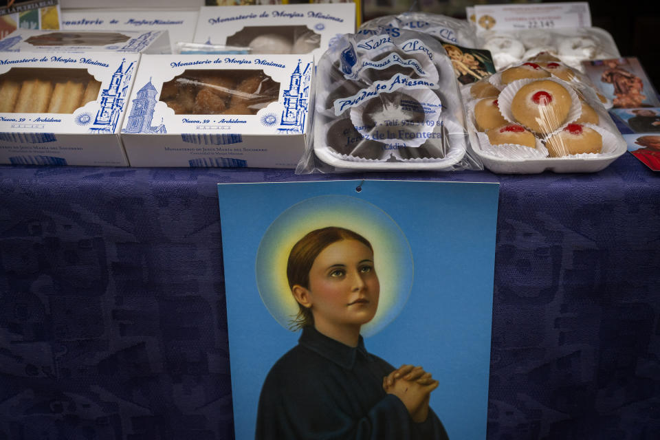 Handmade sweets made by the cloistered nuns of the Monjas Minimas monastery are displayed for sale at the door of a church in Jerez de la Frontera, southern Spain, on Tuesday, Dec. 5, 2023. It's the fortnight before Christmas and all through the world's Catholic convents, nuns and monks are extra busy preparing the traditional delicacies they sell to a loyal fan base even in rapidly secularizing countries. (AP Photo/Emilio Morenatti)