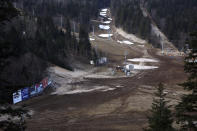 General view over the ski track with only a few patches of snow on Bjelasnica mountain near Sarajevo, Bosnia, Wednesday, Jan. 4, 2023. (AP Photo/Armin Durgut)