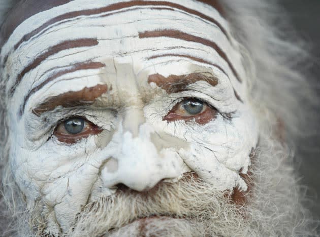 A Hindu Holy man, Bal Mukund Brahmchari, 82, looks on after applying a paste of sandalwood to his face in Allahabad, India, Friday, March 30, 2007. Sandalwood paste, besides being of religious significance, helps in cooling the body temperature. With the onset of summer, different parts of India have started experiencing heat wave conditions. (AP Photo/Rajesh Kumar Singh)