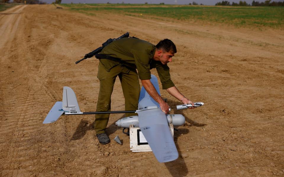 An Israeli military tactical drone operator prepares a drone